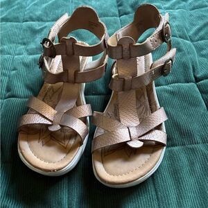Blowfish Tan Sandals with copper rings on side. Size 3 but can fit woman’s 5